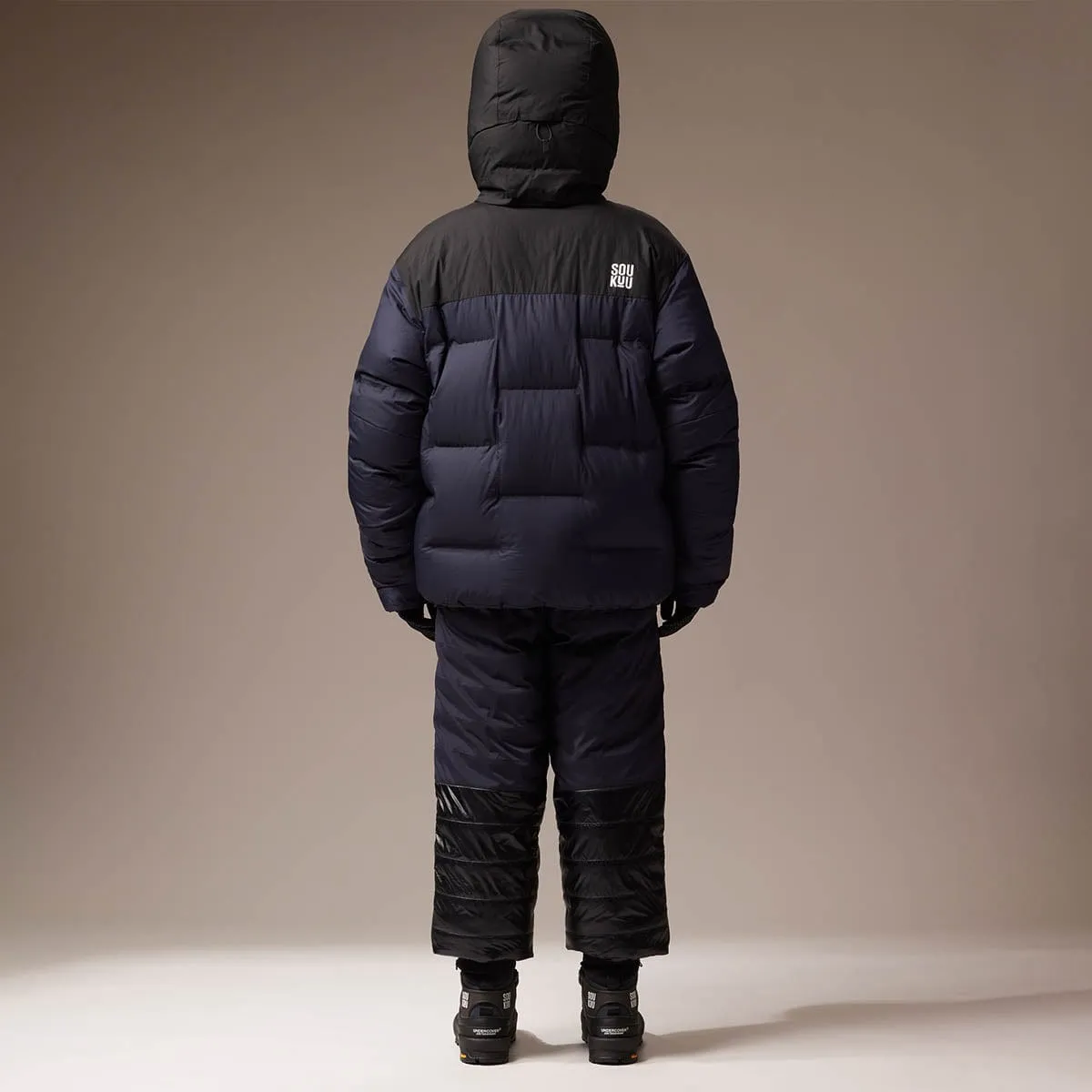 SOUKUU BY THE NORTH FACE X UNDERCOVER PROJECT CLOUD DOWN NUPTSE TNF BLK/AVTOR NVY| Bodega